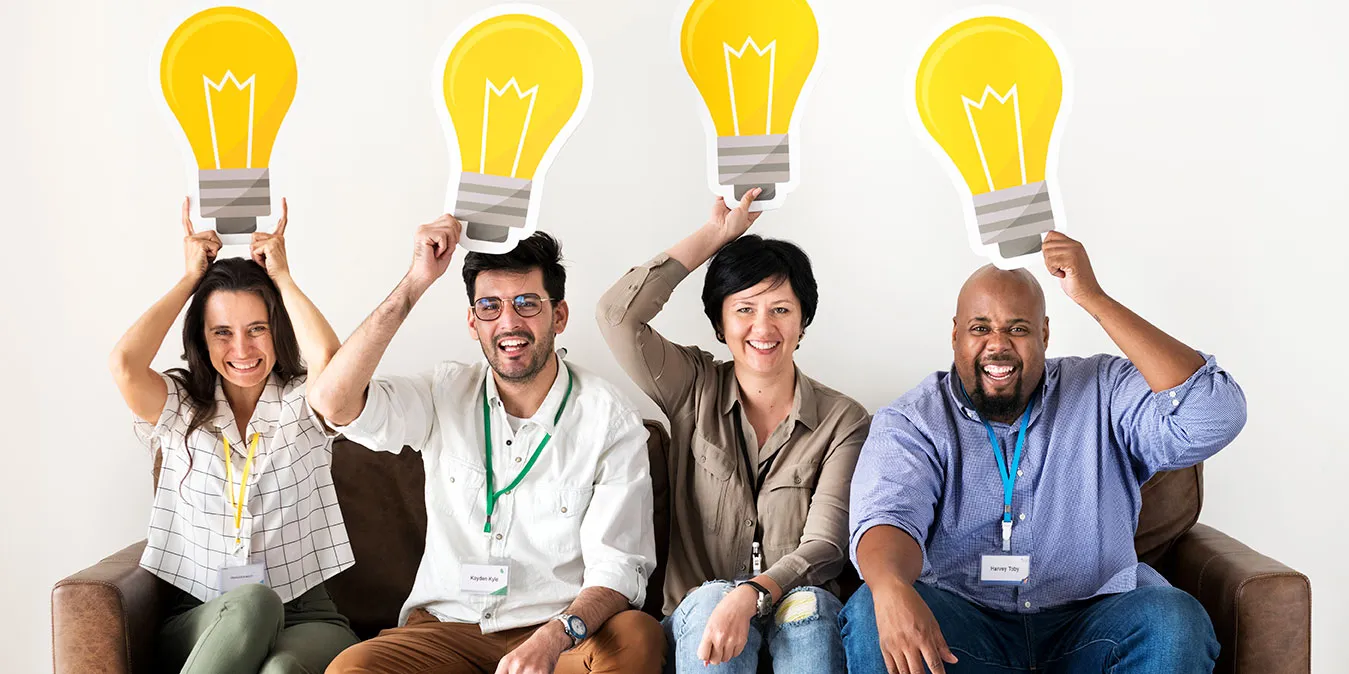 Diverse people with light bulbs representing innovation